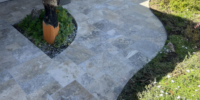 12mm Oyster Travertine French Pattern tiles front porch | Hourigan Landscaping